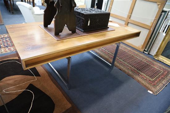 A Bodil Kjær rosewood freestanding working table desk with underframe of chromed steel W.6ft 7in. D.3ft 3in. H.2ft 3in.